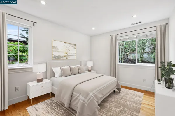 a bedroom with a large bed and a large window