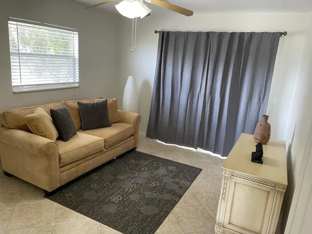 a living room with furniture and a window
