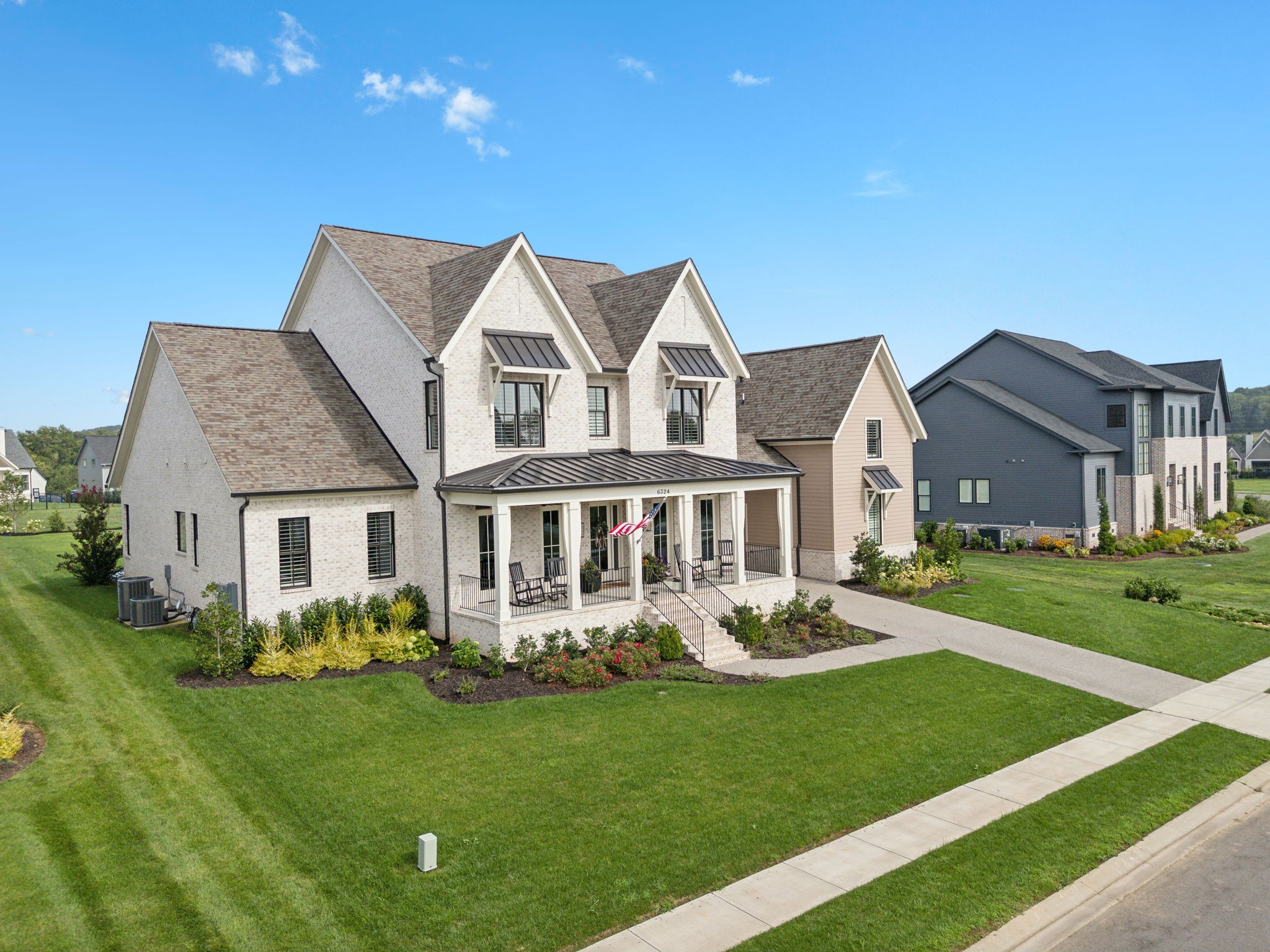 6324 Percheron Lane Arrington, TN 37014 - Photo 1 of 53 a front view of a house with a garden and plants