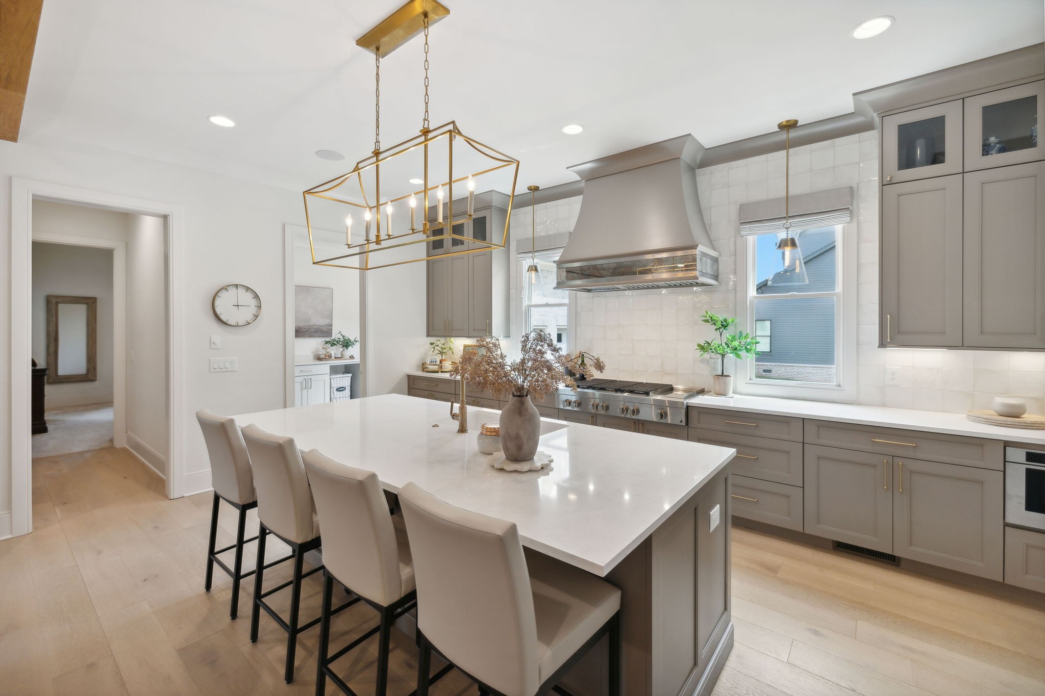 6324 Percheron Lane Arrington, TN 37014 - Photo 15 of 53 a kitchen with stainless steel appliances a sink a stove a dining table and chairs