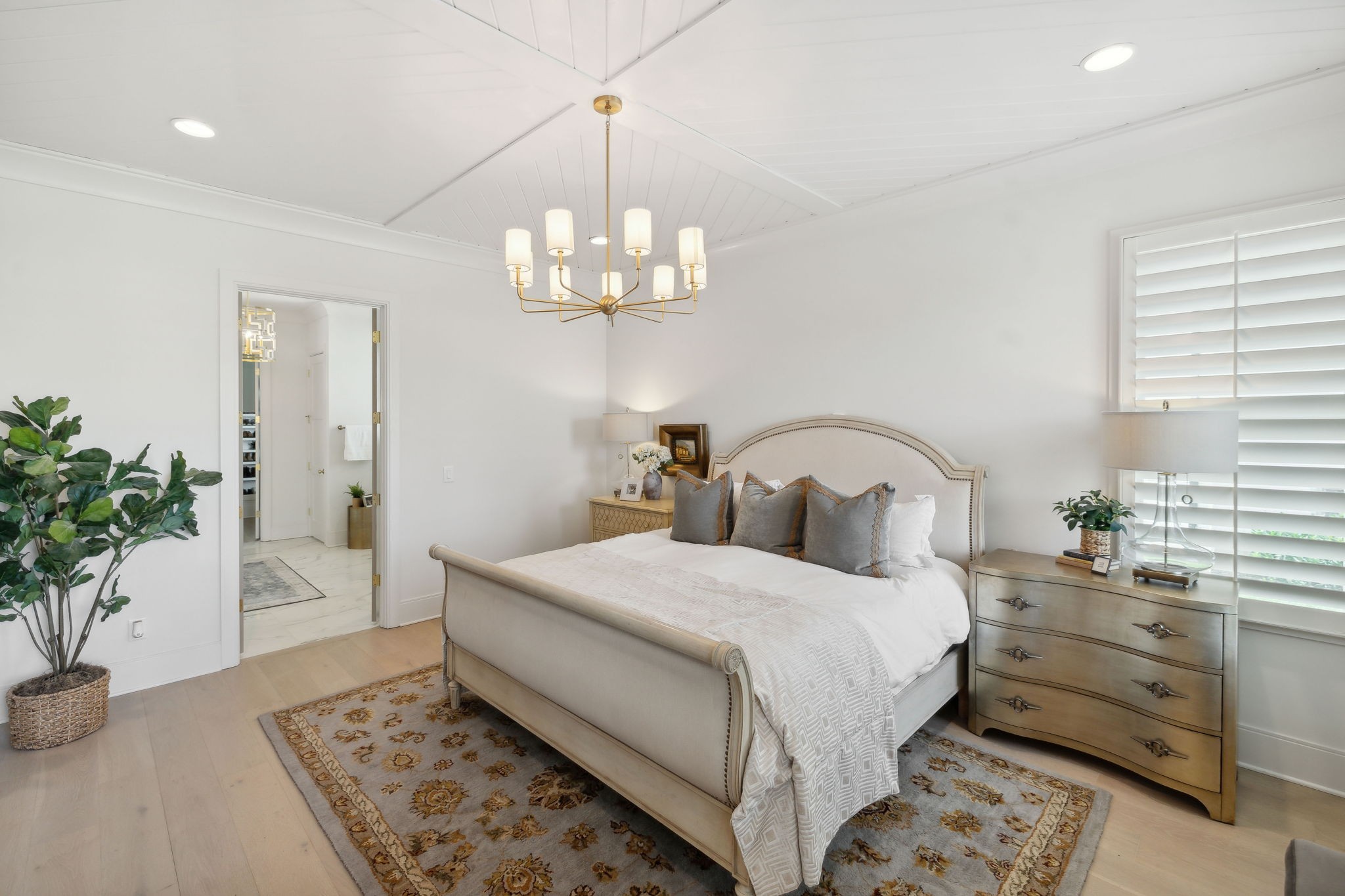 6324 Percheron Lane Arrington, TN 37014 - Photo 20 of 53 a bedroom with a large bed and a chandelier