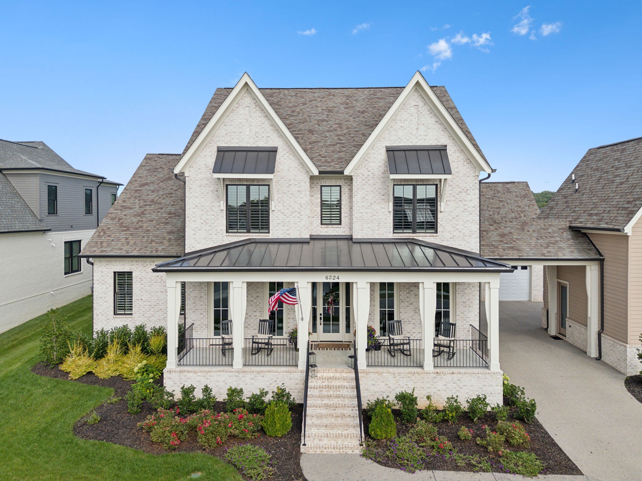 6324 Percheron Lane Arrington, TN 37014 - Photo 4 of 53 a front view of a house with garden and porch