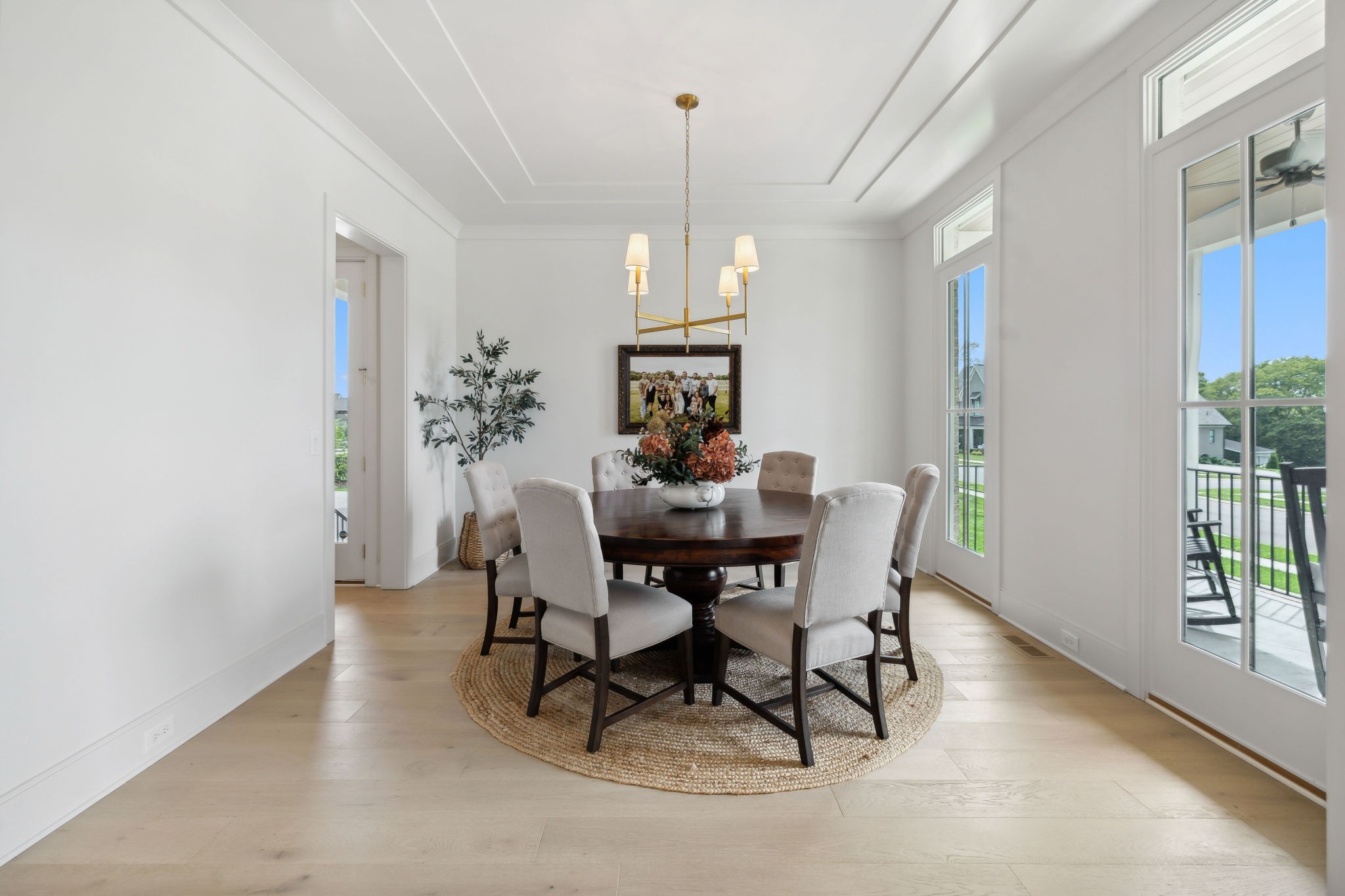 6324 Percheron Lane Arrington, TN 37014 - Photo 9 of 53 a dining room with furniture a chandelier and wooden floor