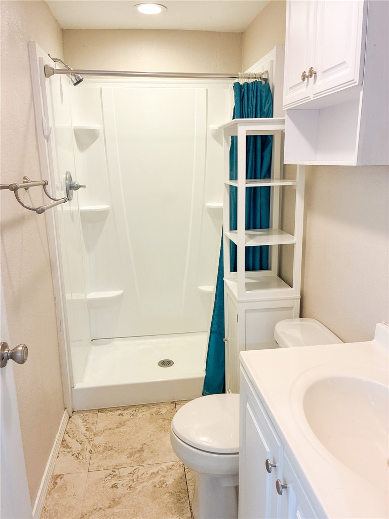 Undisclosed Address Three Rivers, TX 78071 - Photo 5 of 12 a bathroom with a sink toilet and shower