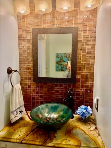 a bathroom with a sink and a mirror