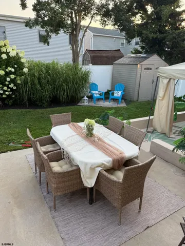 a view of a yard with furniture