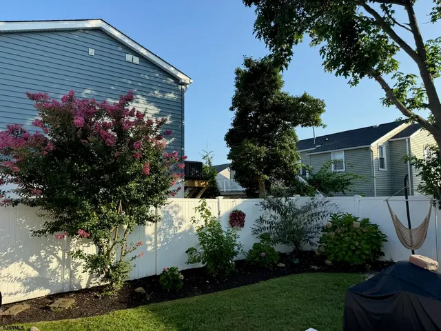 a backyard of a house with lots of green space