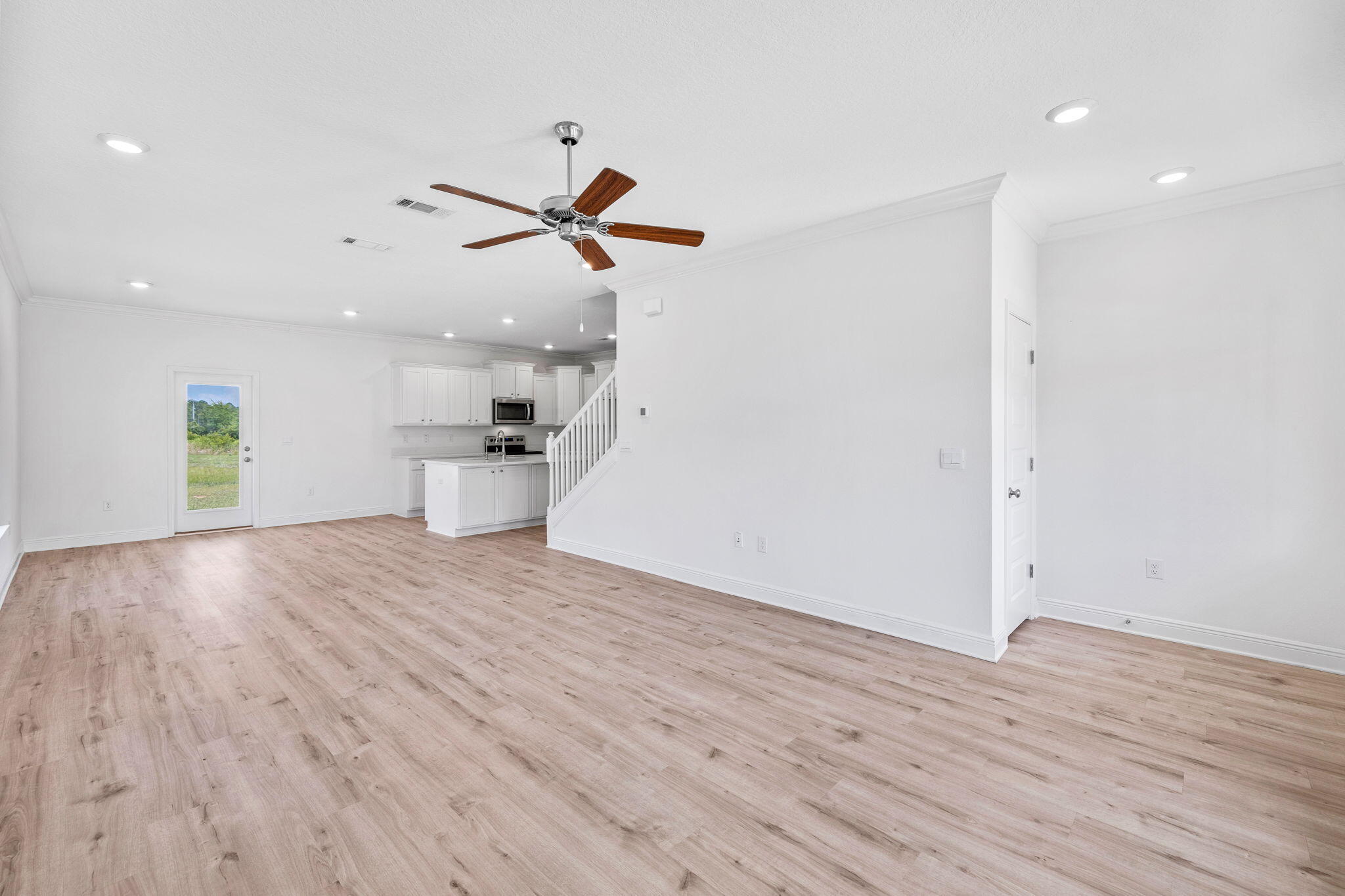 100 JRS Way Santa Rosa Beach, FL 32459 - Photo 14 of 74 a view of empty room with wooden floor and ceiling fan