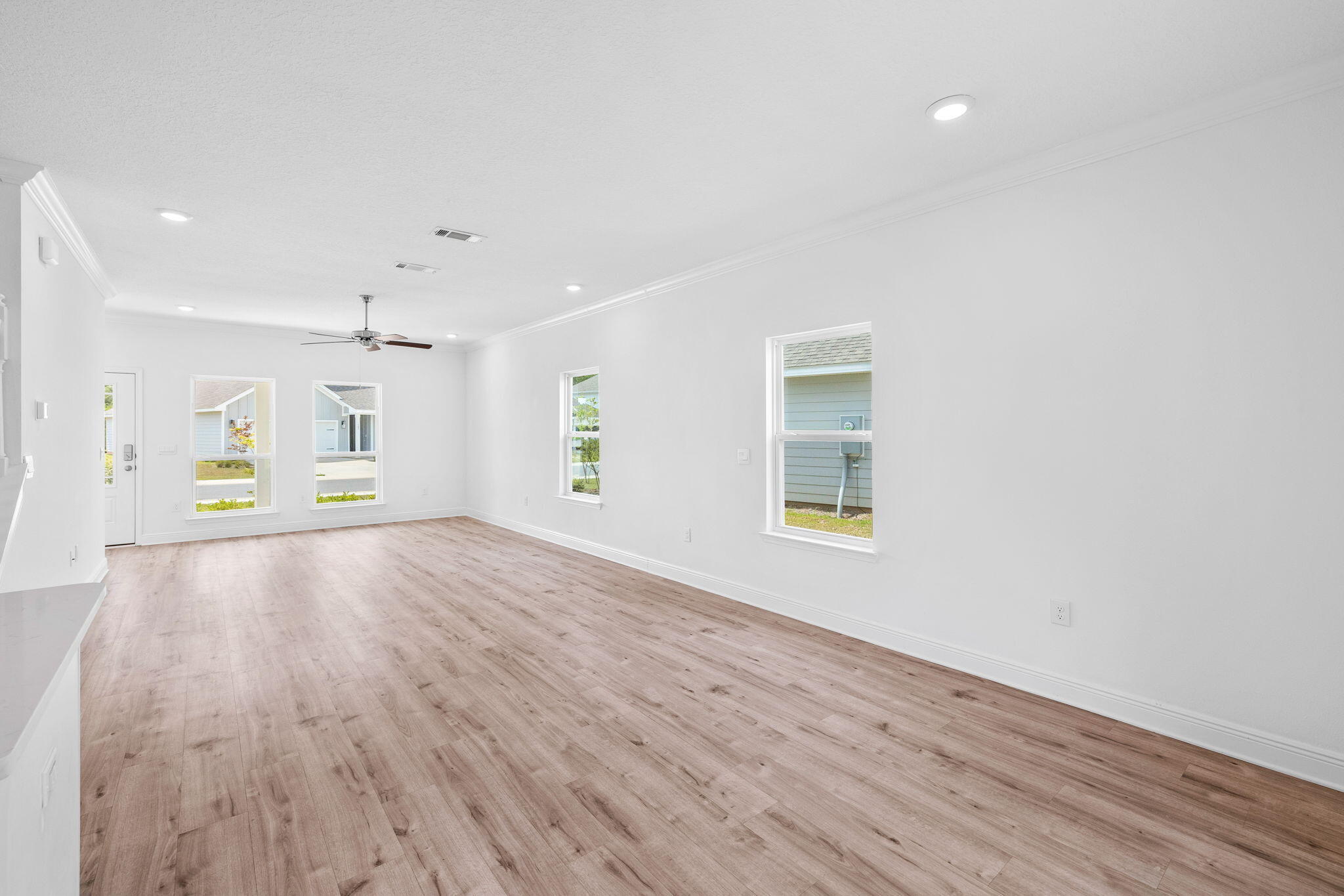 100 JRS Way Santa Rosa Beach, FL 32459 - Photo 17 of 74 a view of an empty room with wooden floor and a window