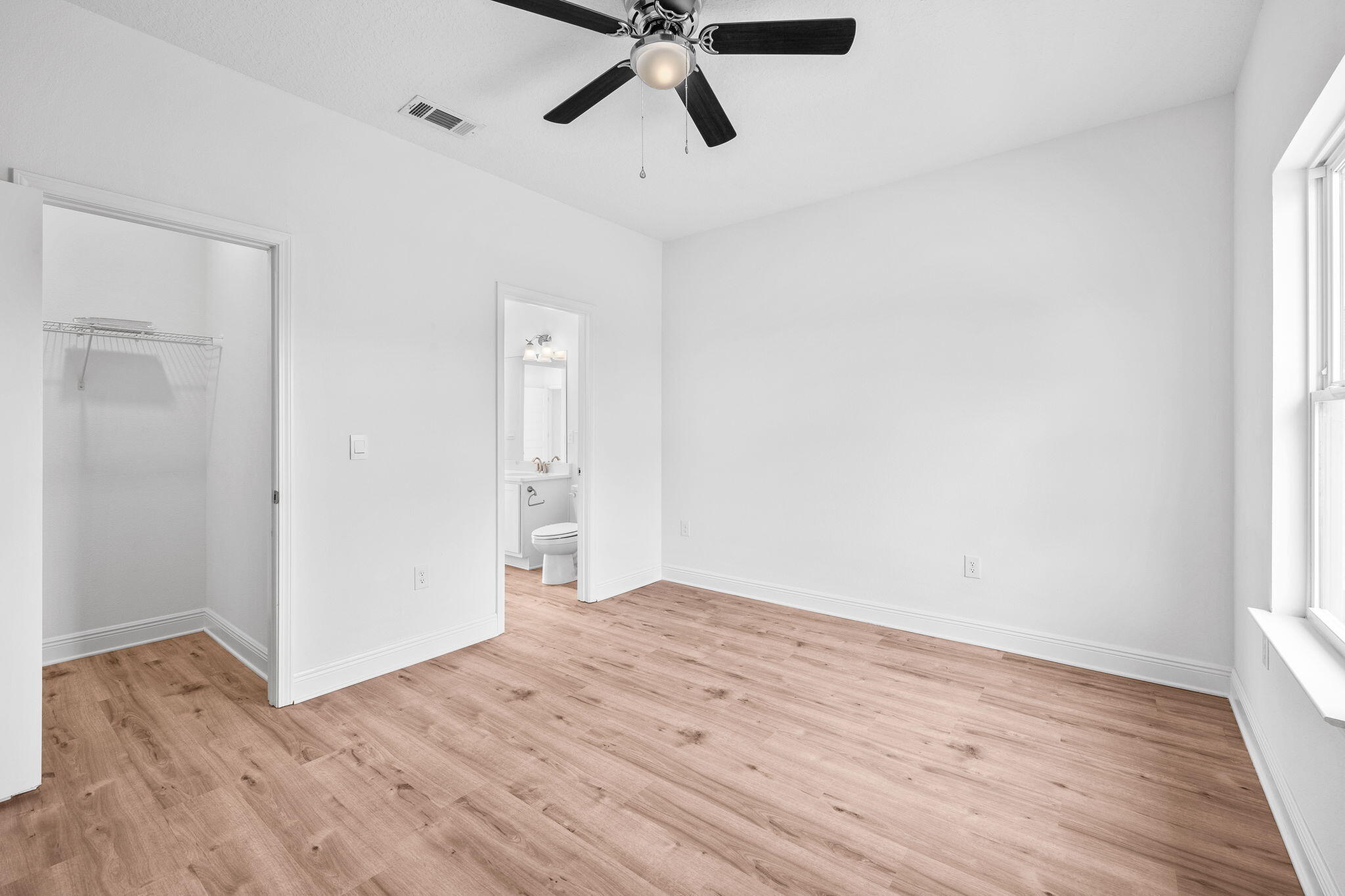 100 JRS Way Santa Rosa Beach, FL 32459 - Photo 22 of 74 a view of empty room with wooden floor and ceiling fan