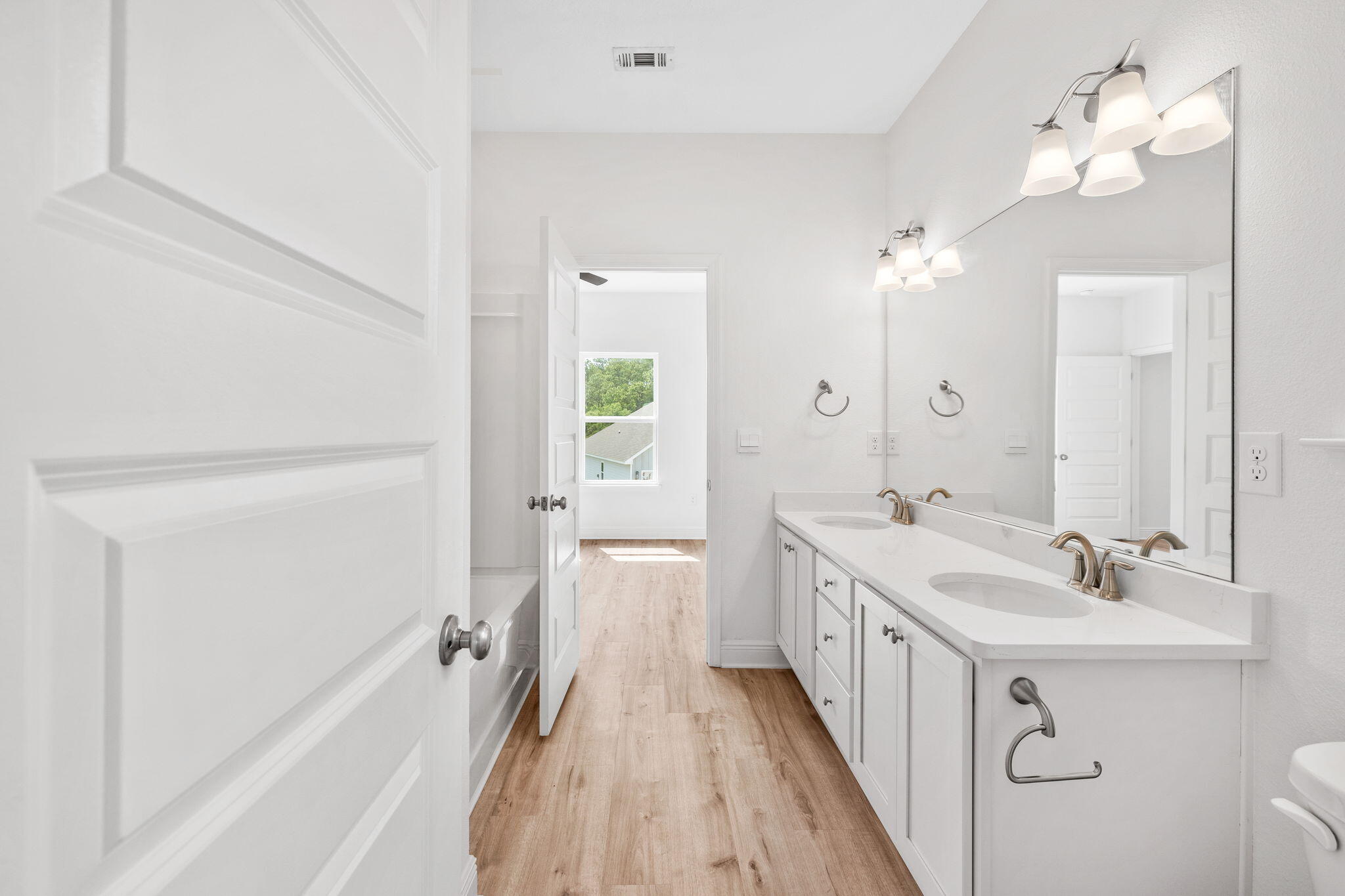 100 JRS Way Santa Rosa Beach, FL 32459 - Photo 23 of 74 a spacious bathroom with a double vanity sink and a mirror