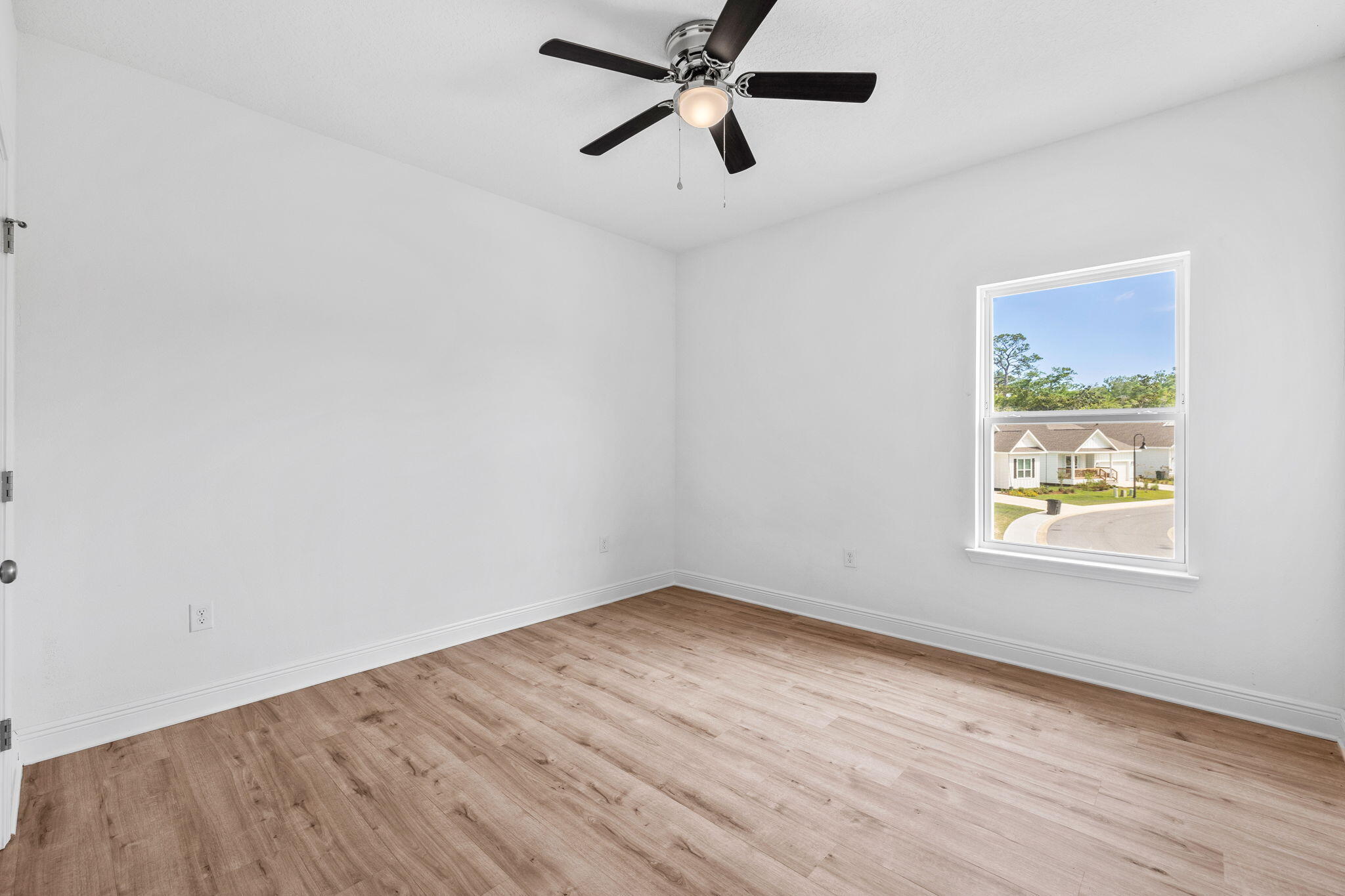 100 JRS Way Santa Rosa Beach, FL 32459 - Photo 26 of 74 an empty room with wooden floor and windows