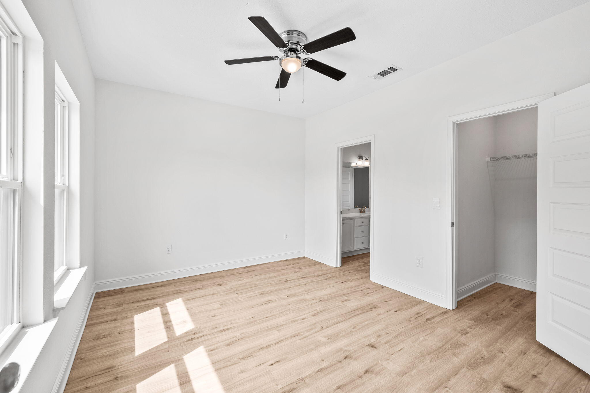 100 JRS Way Santa Rosa Beach, FL 32459 - Photo 28 of 74 a view of an empty room with window and a ceiling fan