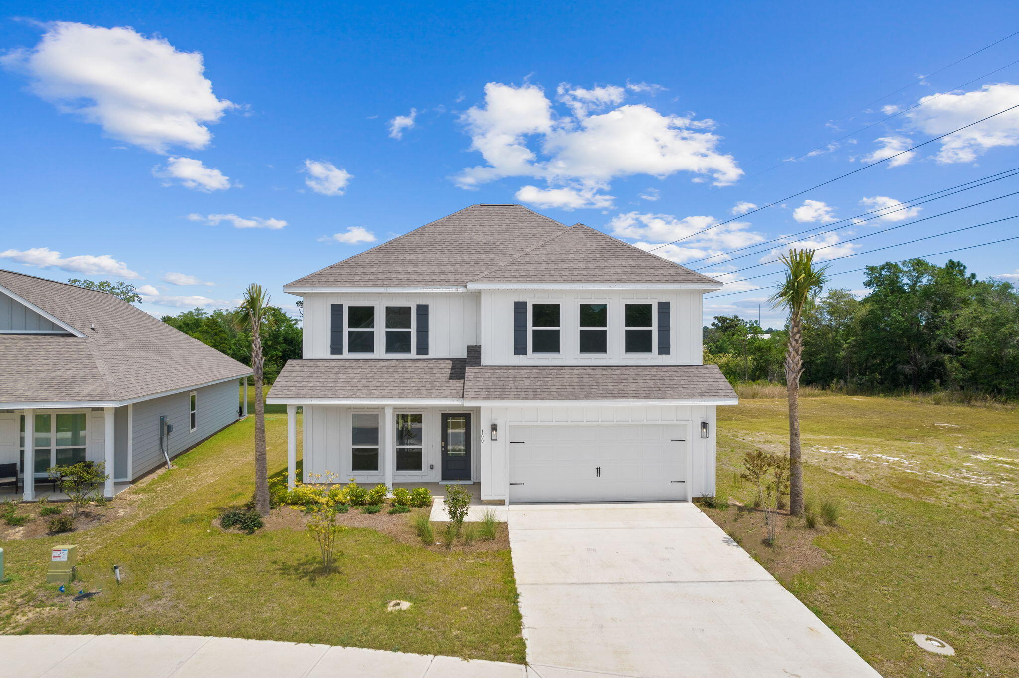 100 JRS Way Santa Rosa Beach, FL 32459 - Photo 3 of 74 a front view of a house with a yard