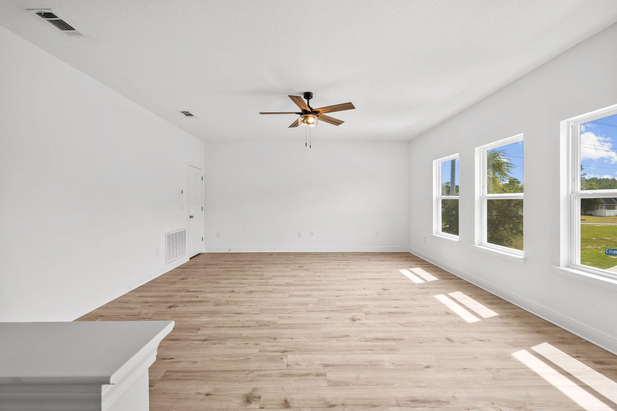 100 JRS Way Santa Rosa Beach, FL 32459 - Photo 34 of 74 wooden floor in an empty room with a window