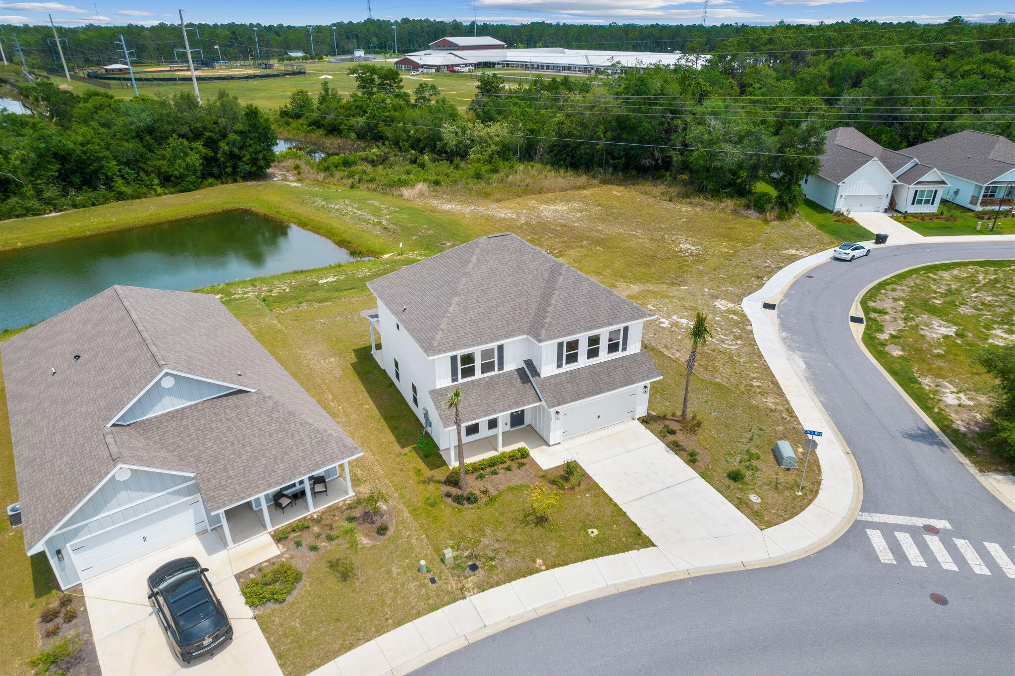 100 JRS Way Santa Rosa Beach, FL 32459 - Photo 4 of 74 an aerial view of a house with swimming pool and garden