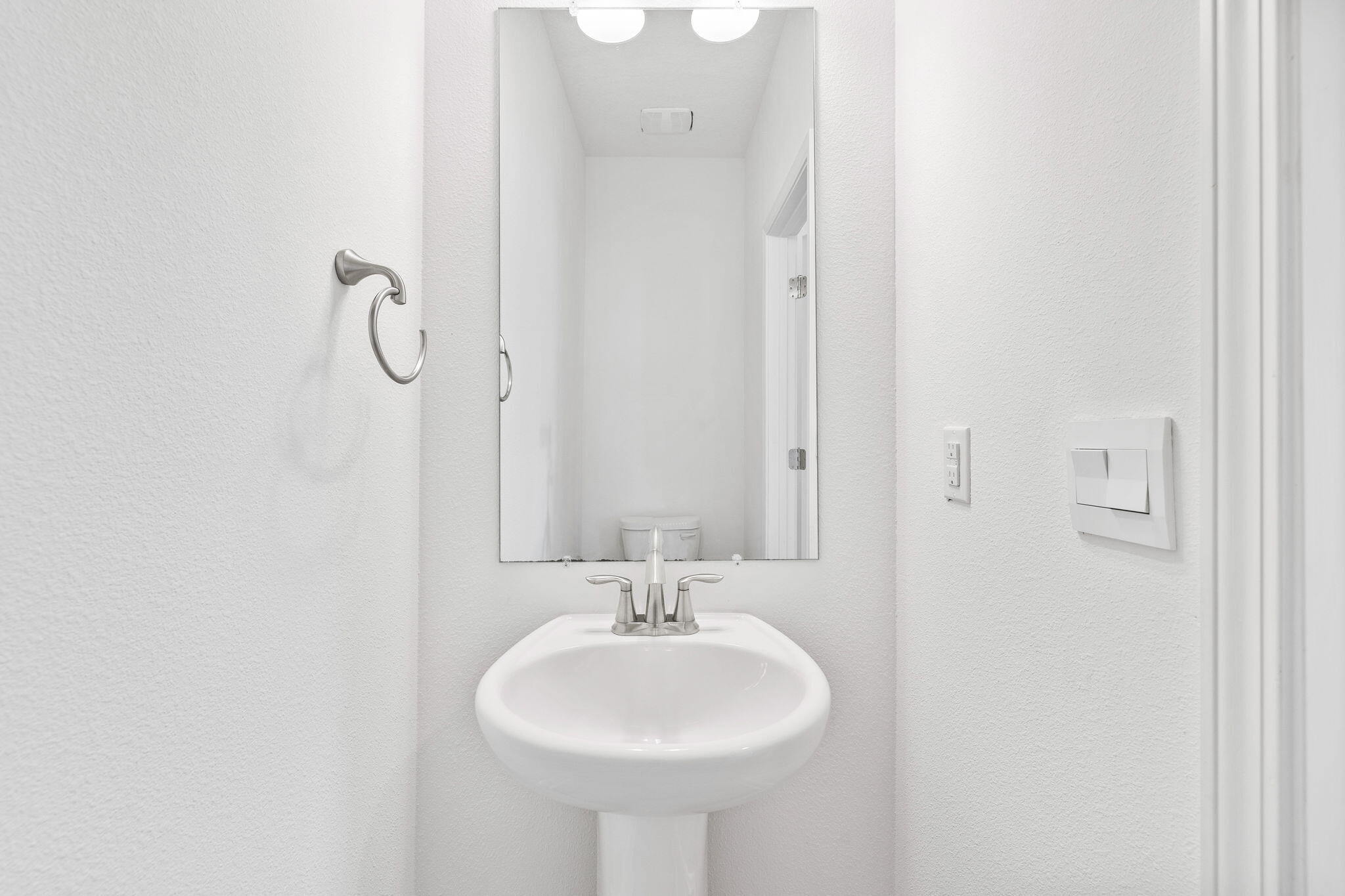 100 JRS Way Santa Rosa Beach, FL 32459 - Photo 42 of 74 a bathroom with a sink a mirror and a shower