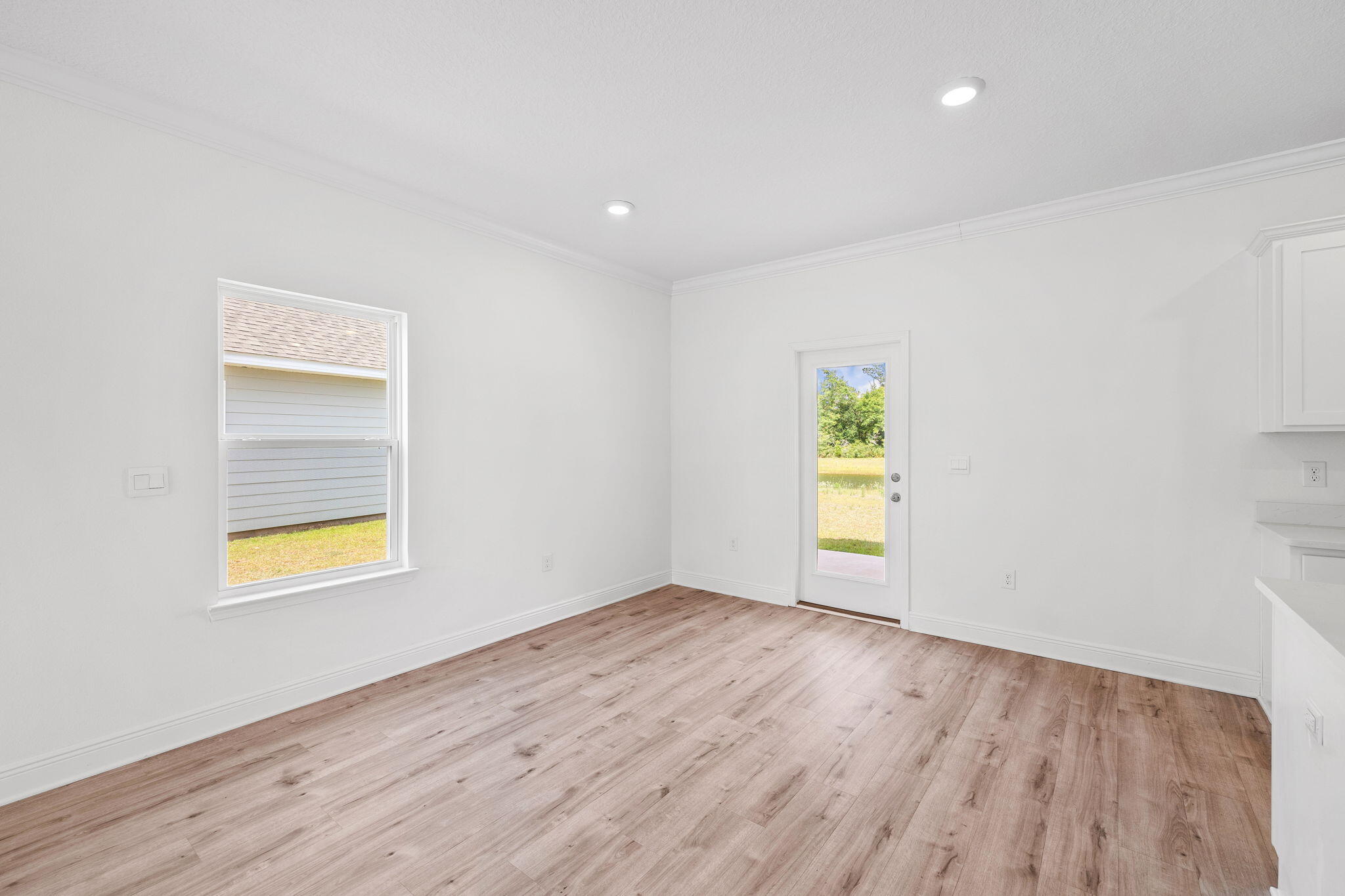 100 JRS Way Santa Rosa Beach, FL 32459 - Photo 50 of 74 an empty room with a window and wooden floor