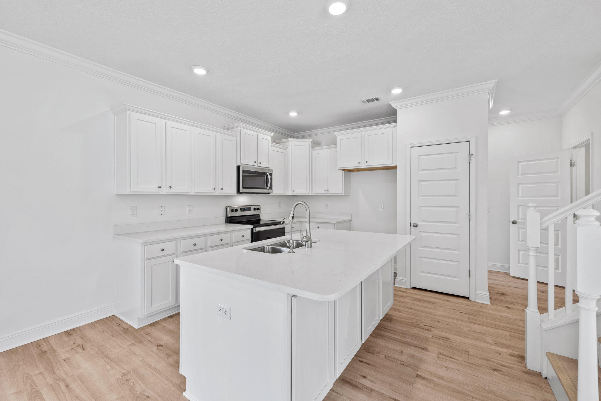 100 JRS Way Santa Rosa Beach, FL 32459 - Photo 5 of 74 a kitchen with appliances a sink and cabinets