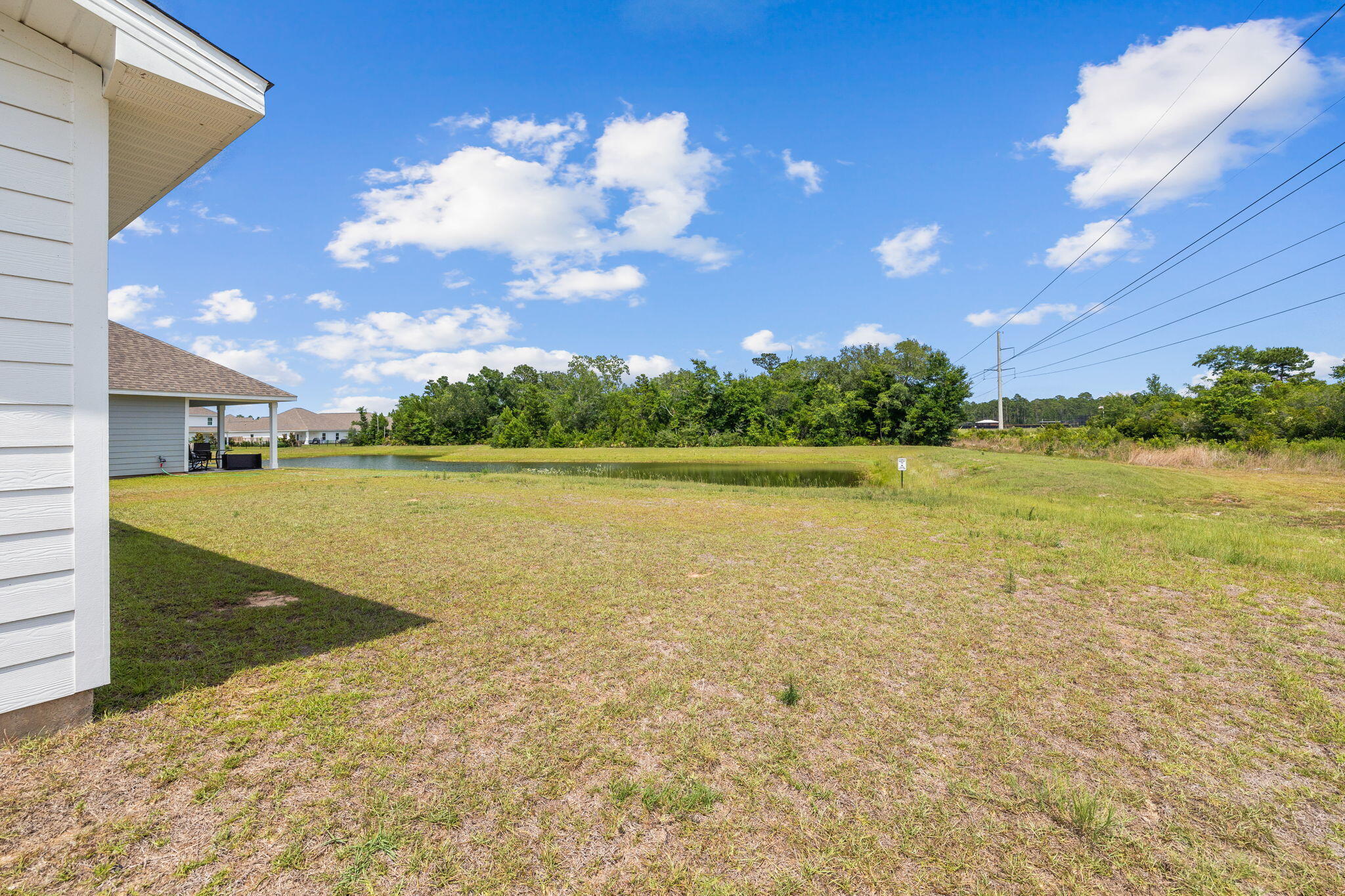 100 JRS Way Santa Rosa Beach, FL 32459 - Photo 57 of 74 a view of a lake with a building in the background