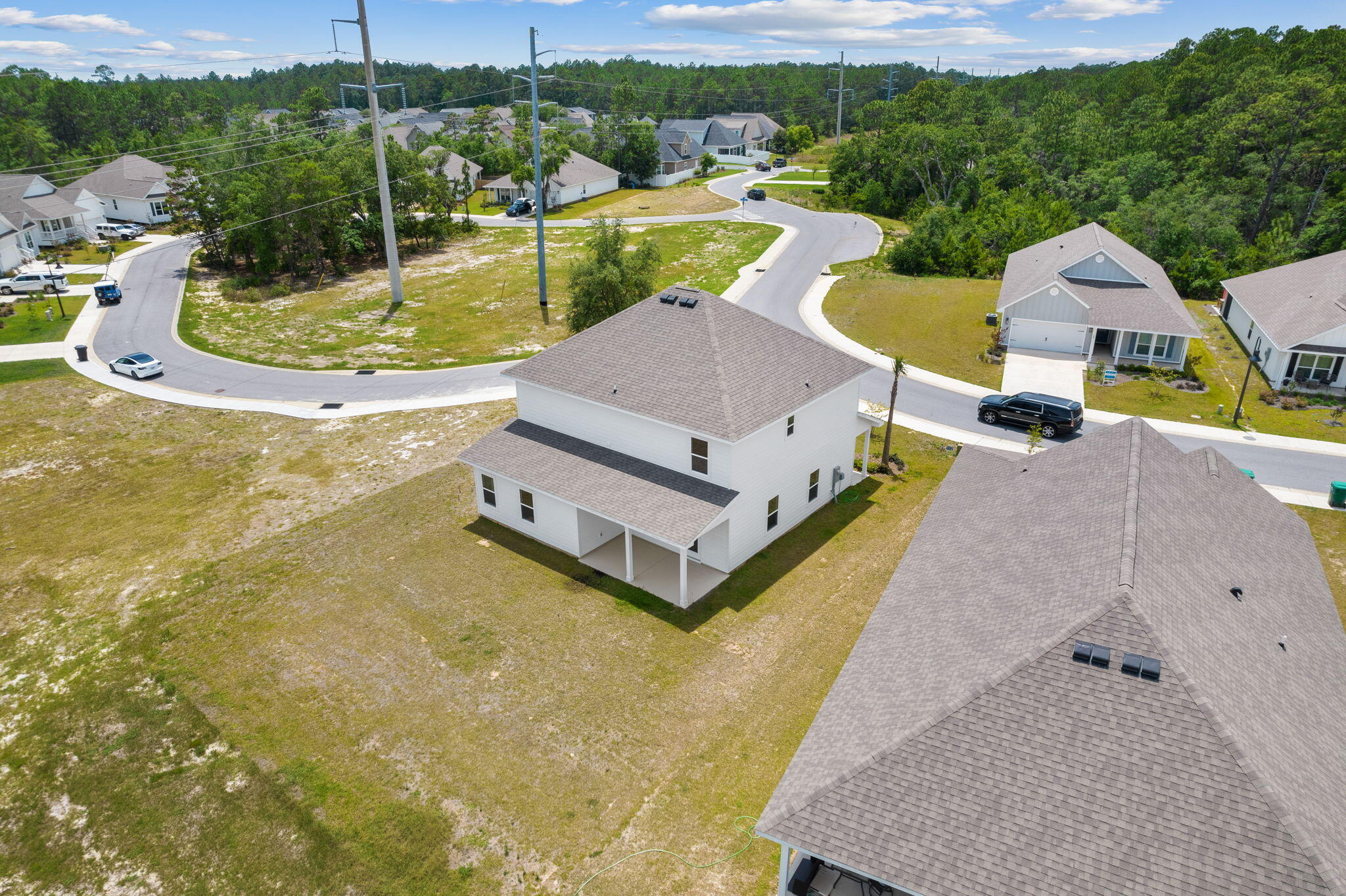 100 JRS Way Santa Rosa Beach, FL 32459 - Photo 63 of 74 a aerial view of a house with swimming pool and a yard