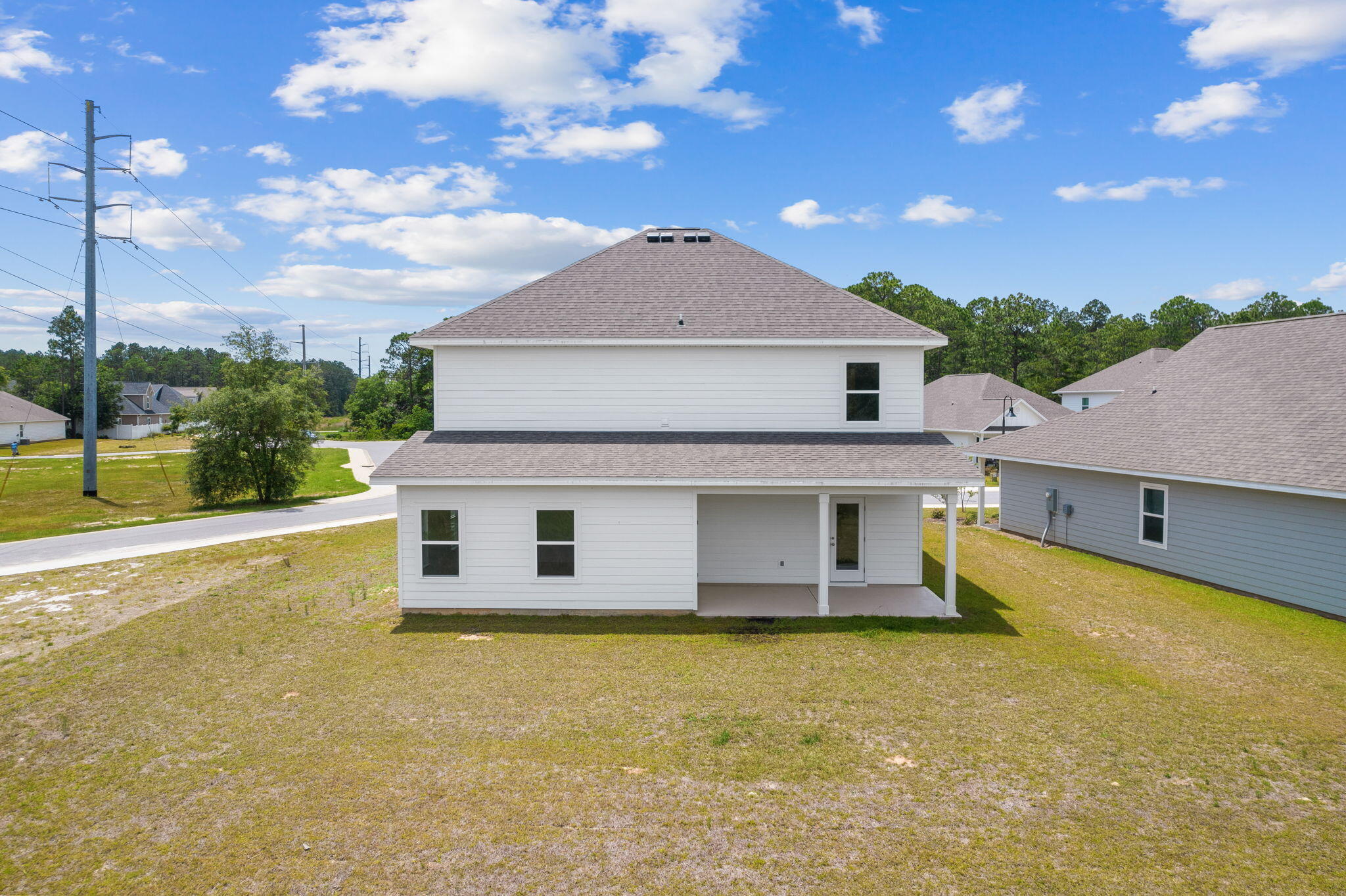 100 JRS Way Santa Rosa Beach, FL 32459 - Photo 64 of 74 a view of a house with a backyard