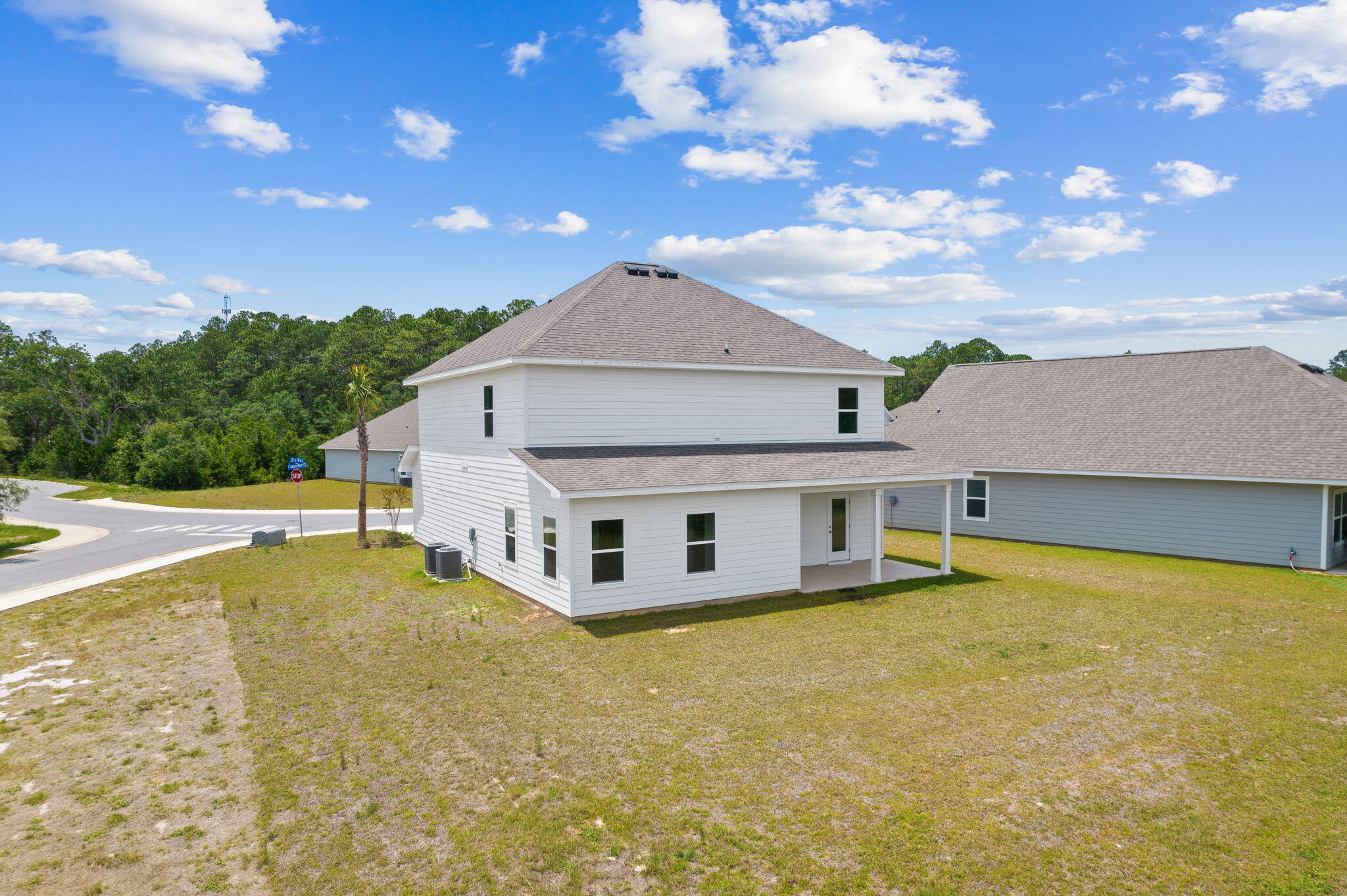 100 JRS Way Santa Rosa Beach, FL 32459 - Photo 66 of 74 a front view of a house with a big yard and large tree