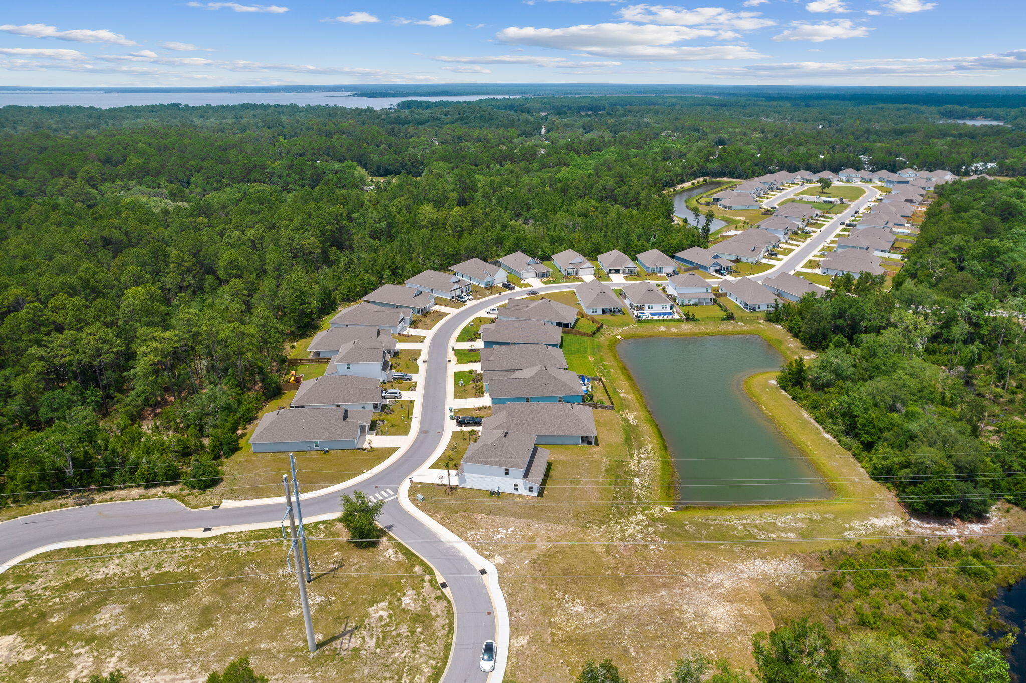 100 JRS Way Santa Rosa Beach, FL 32459 - Photo 70 of 74 an aerial view of a house with outdoor space swimming pool and mountains