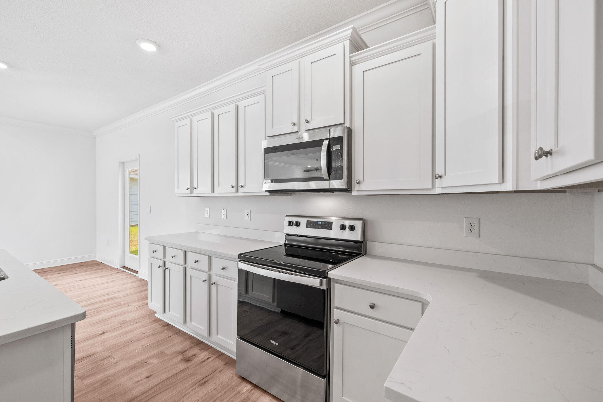 100 JRS Way Santa Rosa Beach, FL 32459 - Photo 7 of 74 a kitchen with stainless steel appliances granite countertop white cabinets a sink and dishwasher