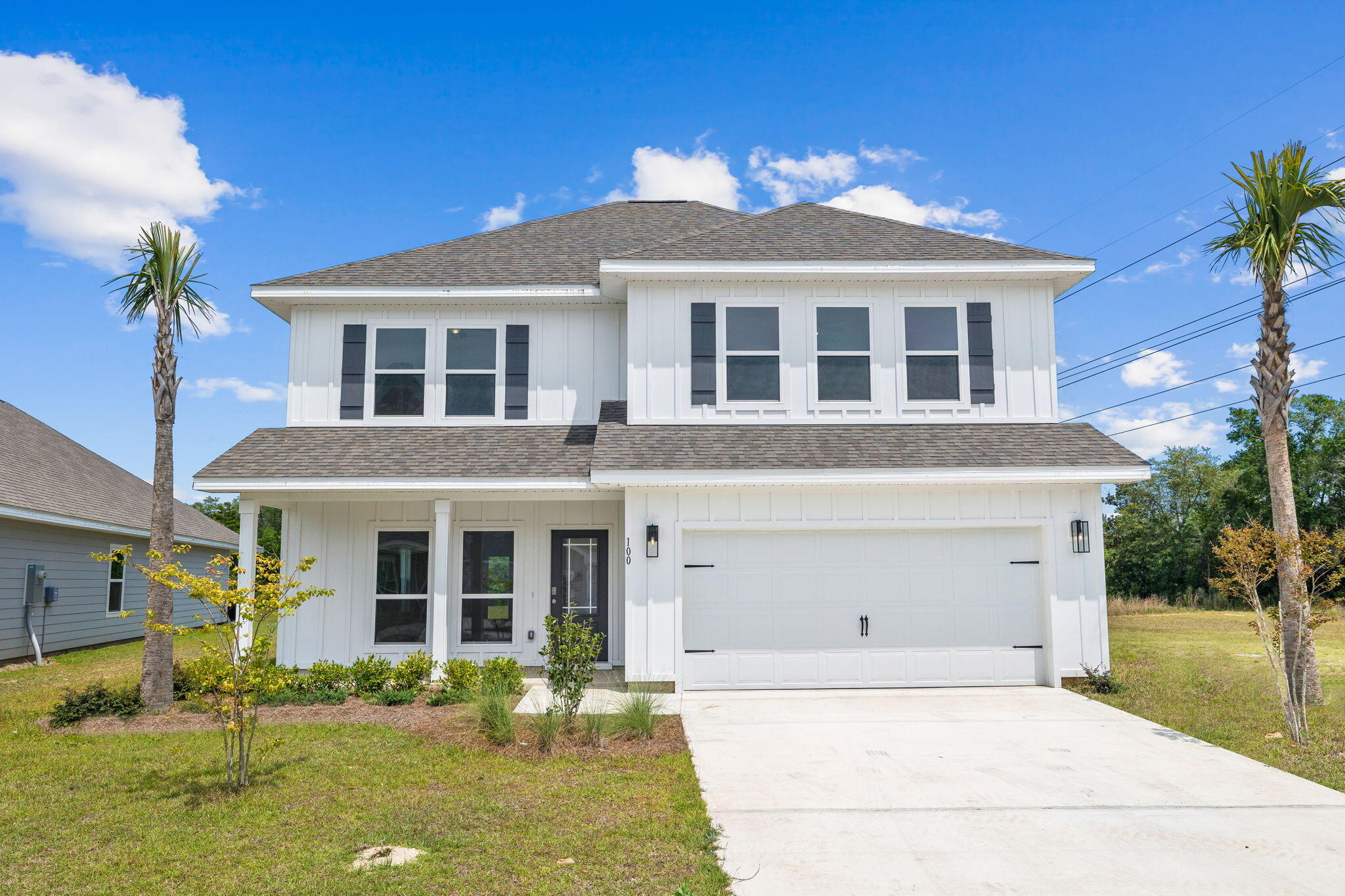 100 JRS Way Santa Rosa Beach, FL 32459 - Photo 74 of 74 a front view of a house with swimming pool and glass windows