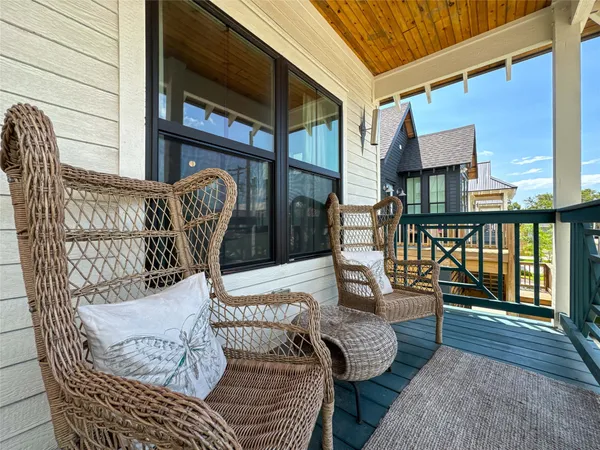 a view of balcony with furniture