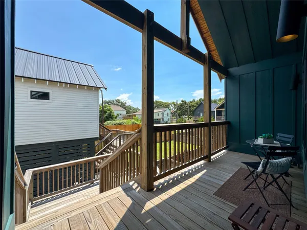 a view of balcony with wooden floor