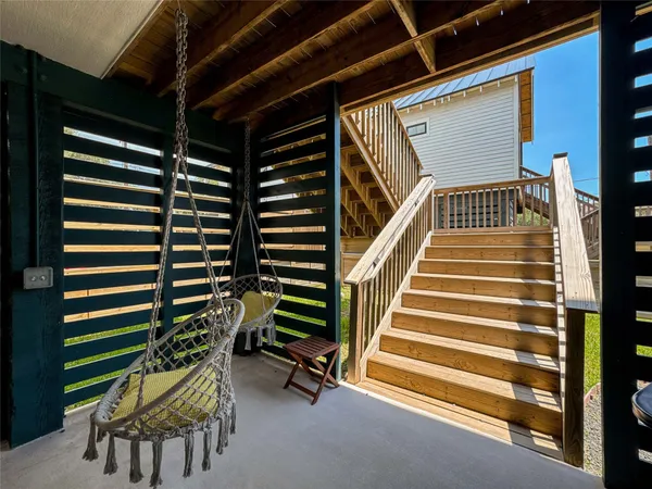 a backyard of a house with table and chairs