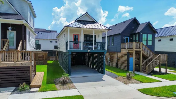 an aerial view of multiple houses with yard