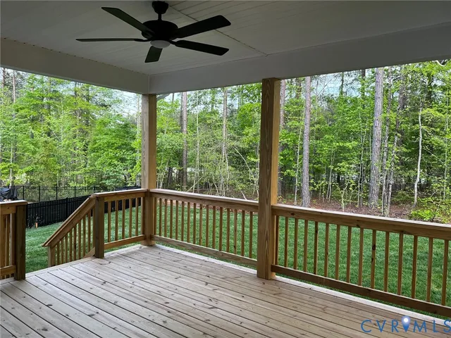 a view of a balcony with wooden floor