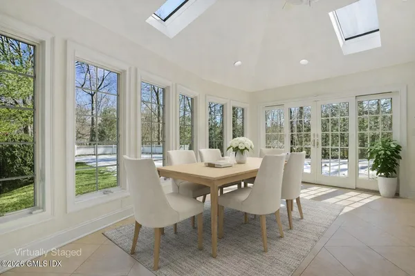 a view of a room with large windows