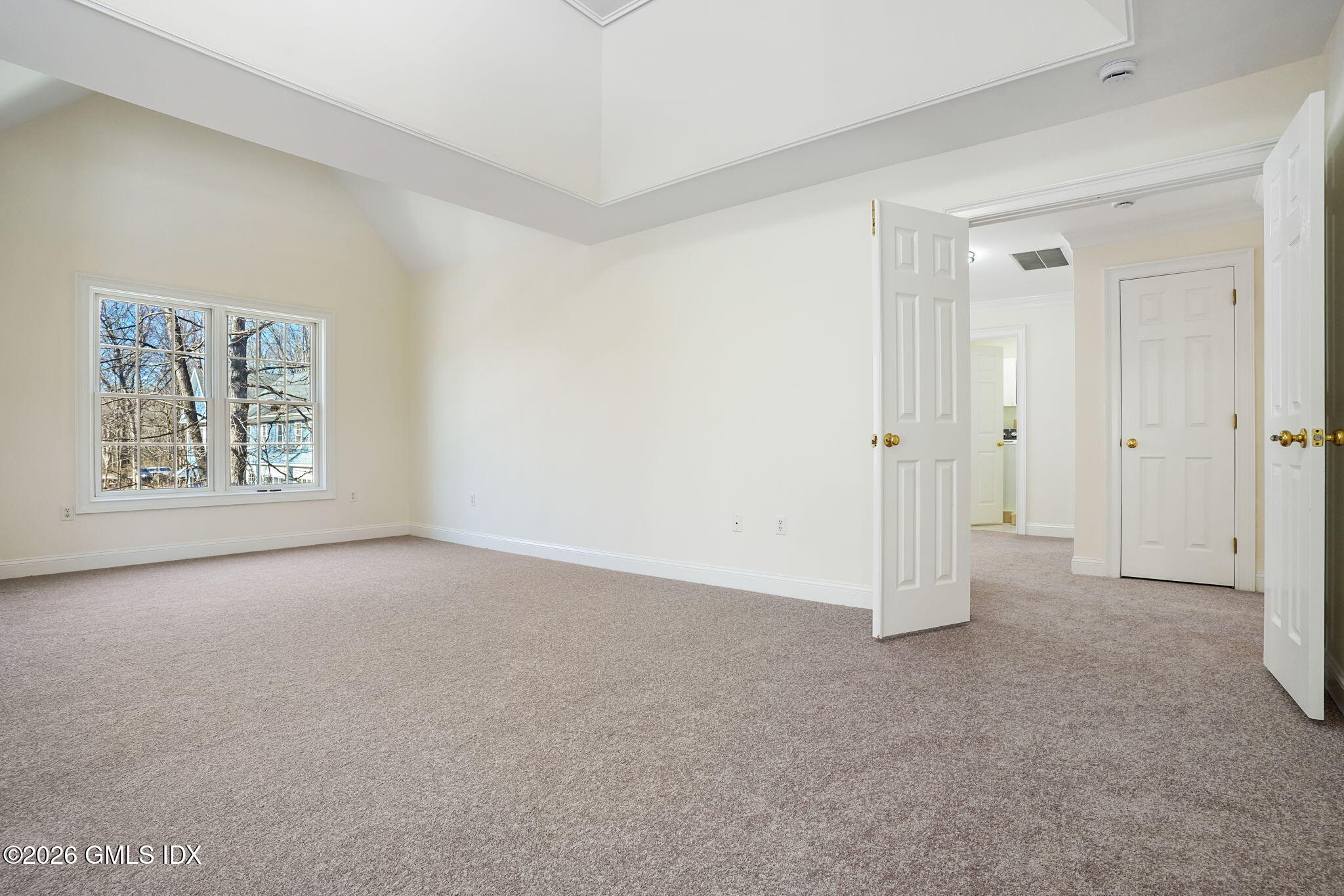 83 Westport Road Wilton, CT 06897 - Photo 17 of 45 an empty room with windows and closet