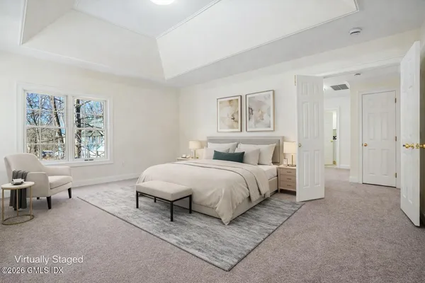 an empty room with windows and closet