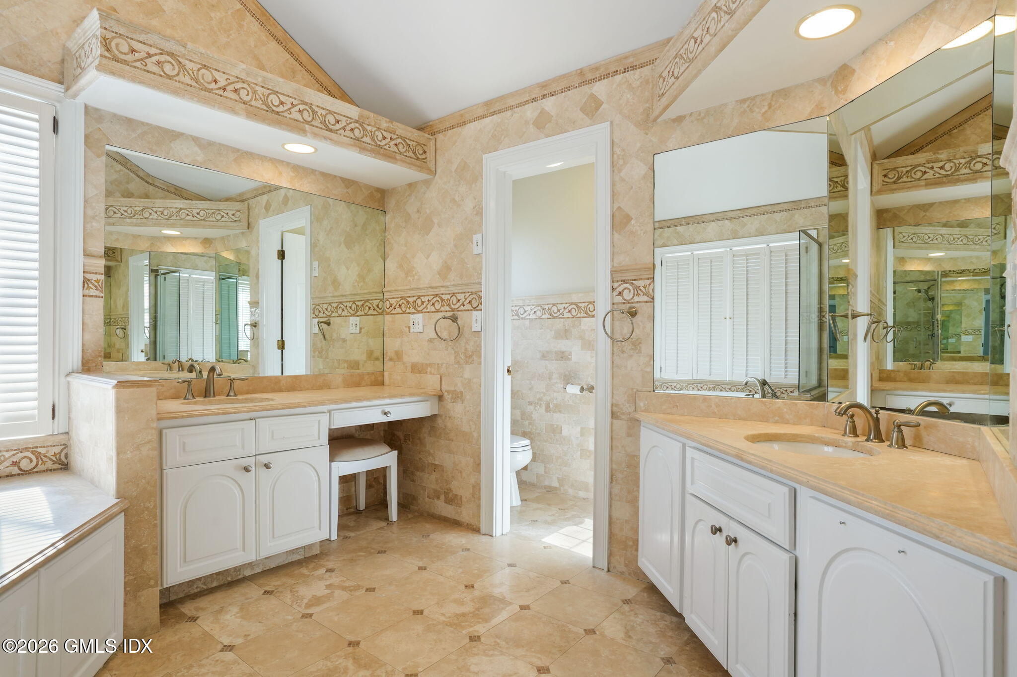 83 Westport Road Wilton, CT 06897 - Photo 22 of 45 a spacious bathroom with a granite countertop sink mirror and a