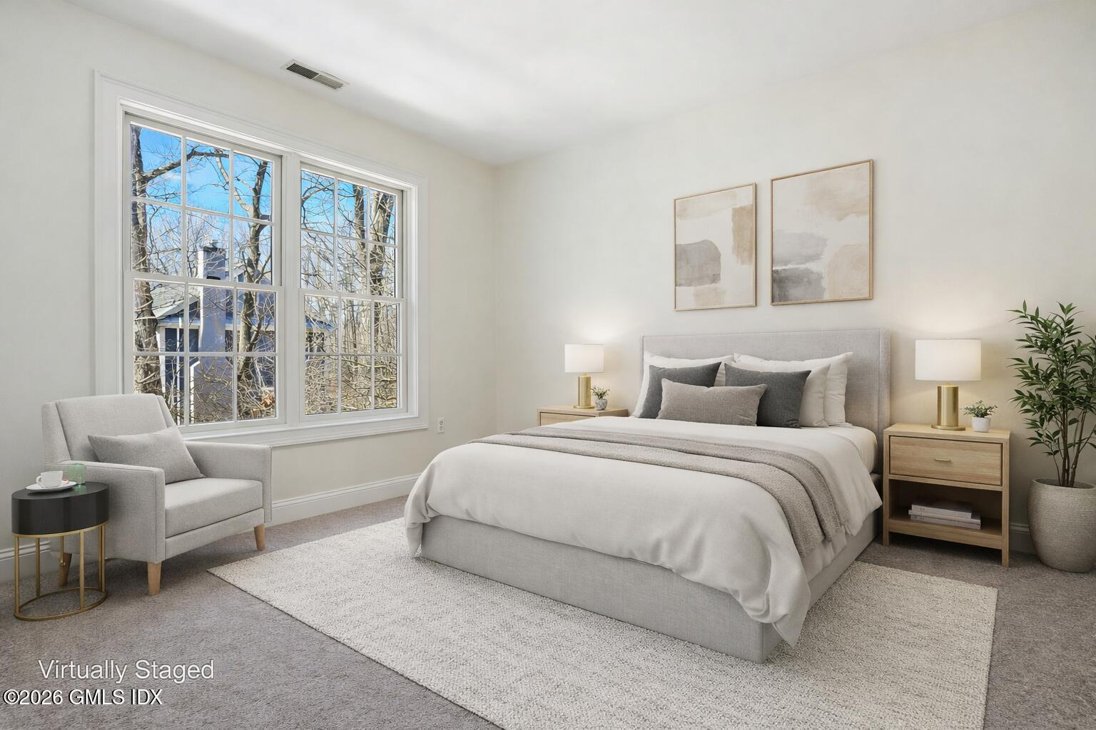 83 Westport Road Wilton, CT 06897 - Photo 26 of 45 a spacious bedroom with a bed and a couch