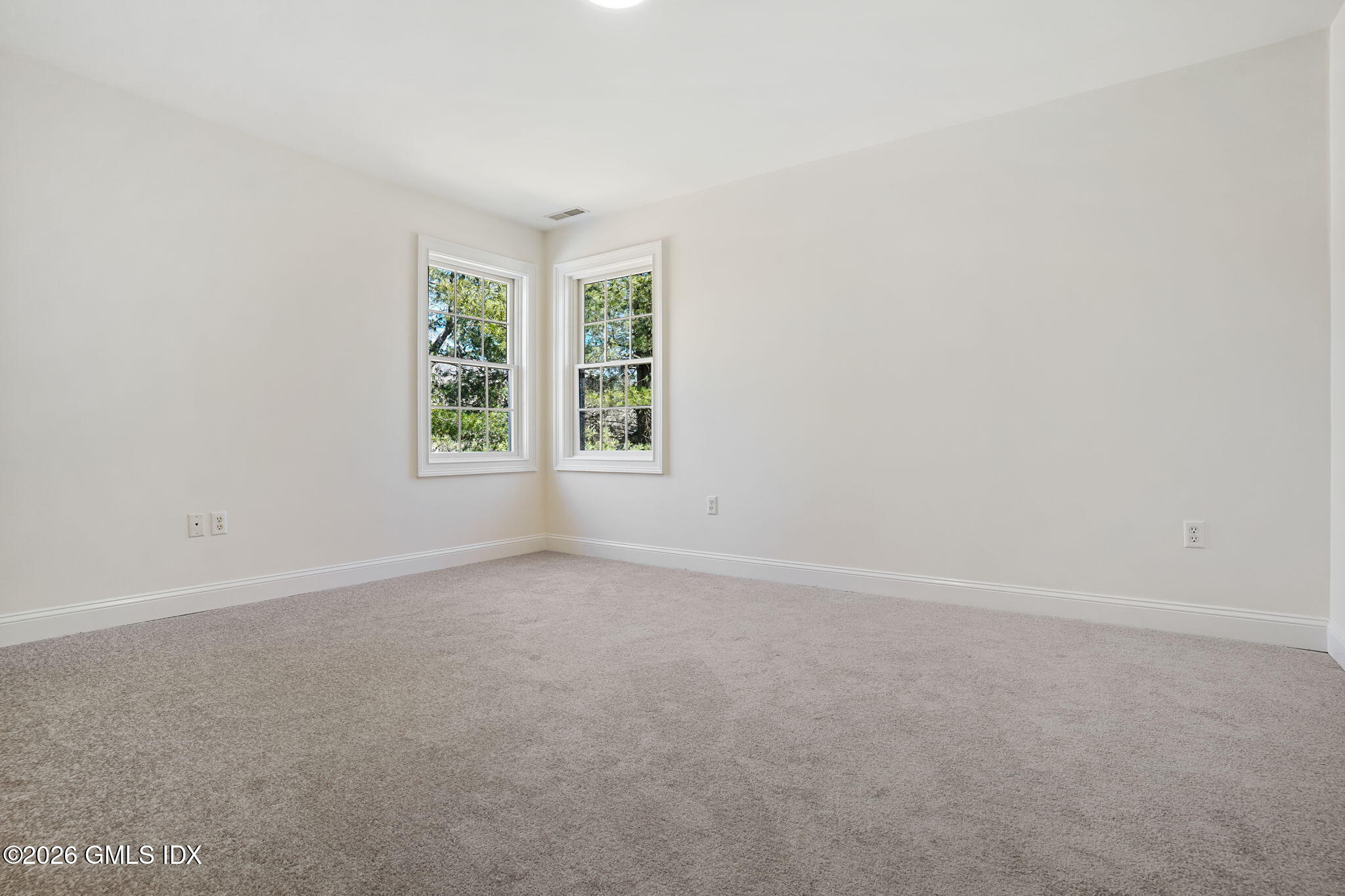 83 Westport Road Wilton, CT 06897 - Photo 27 of 45 an empty room with windows