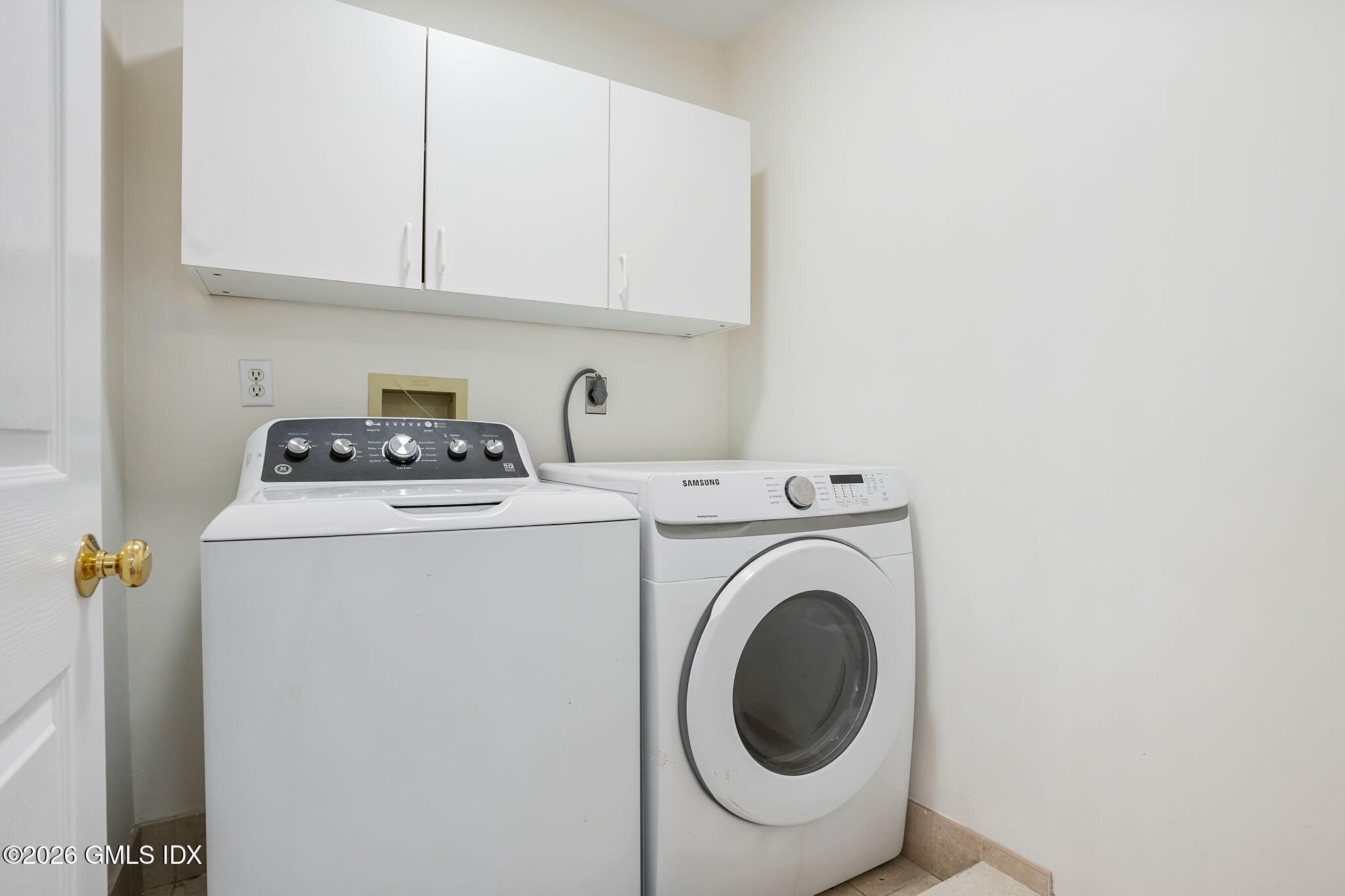 83 Westport Road Wilton, CT 06897 - Photo 30 of 45 a utility room with dryer and washer