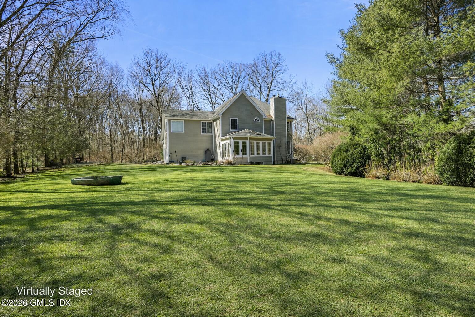 83 Westport Road Wilton, CT 06897 - Photo 39 of 45 a front view of a house with a yard