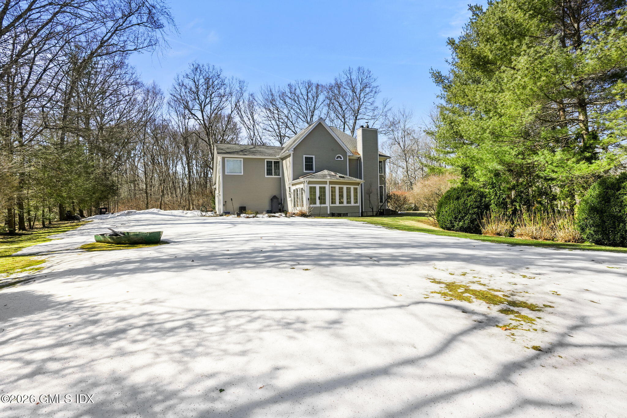 83 Westport Road Wilton, CT 06897 - Photo 40 of 45 a view of a house with a yard
