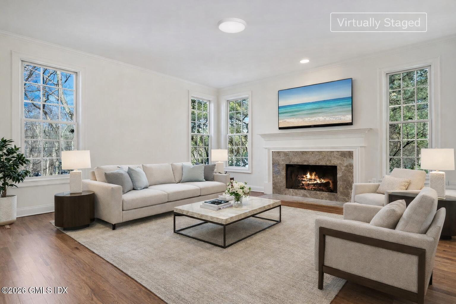 83 Westport Road Wilton, CT 06897 - Photo 4 of 45 a living room with furniture and a fireplace