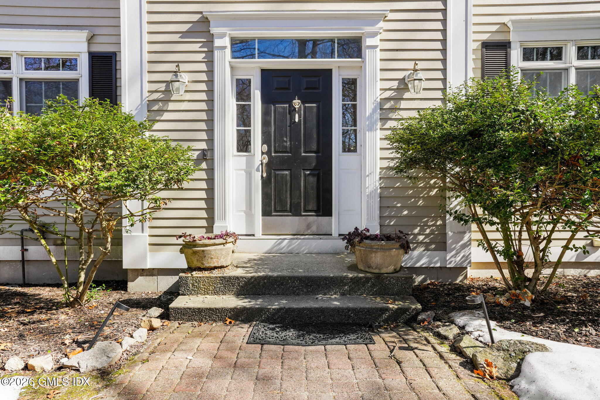 83 Westport Road Wilton, CT 06897 - Photo 44 of 45 a front view of a house with a yard