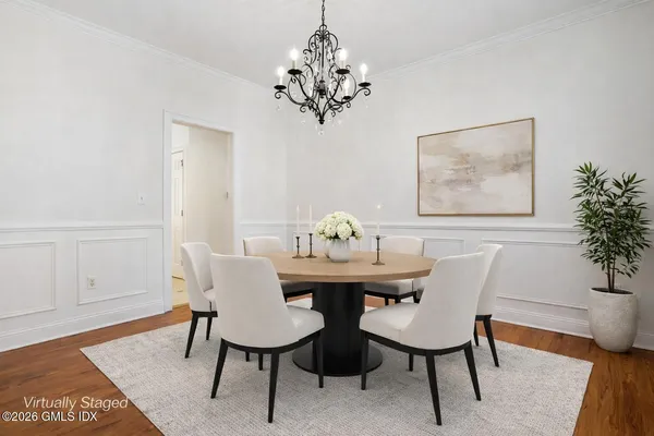 a view of a dining room with furniture and wooden floor