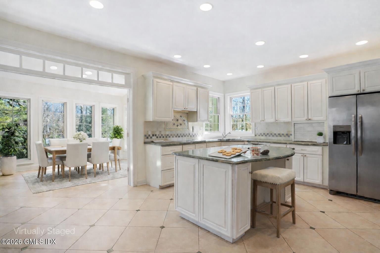 83 Westport Road Wilton, CT 06897 - Photo 10 of 45 a kitchen with stainless steel appliances granite countertop a stove a sink a refrigerator and white cabinets
