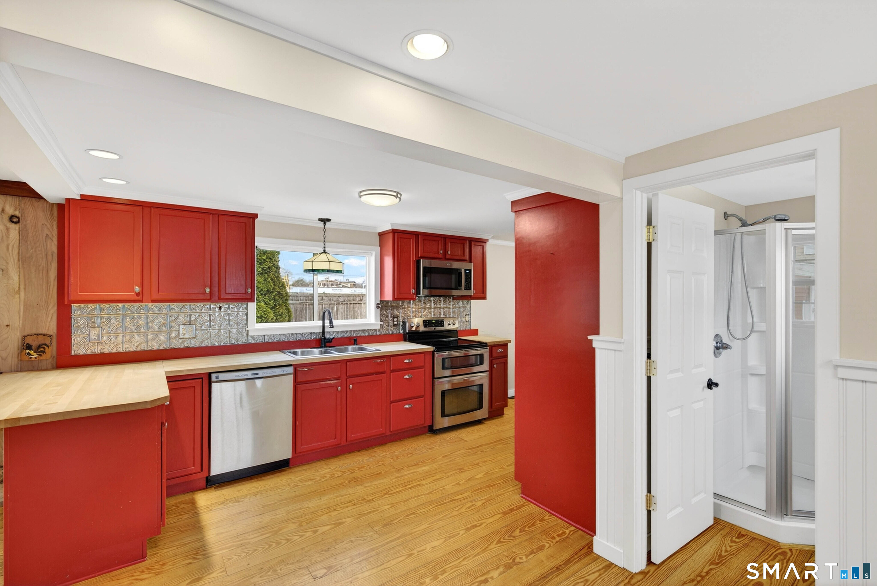 25 Pond Road Old Saybrook, CT 06475 - Photo 16 of 40 a kitchen with stainless steel appliances granite countertop a refrigerator and a stove top oven