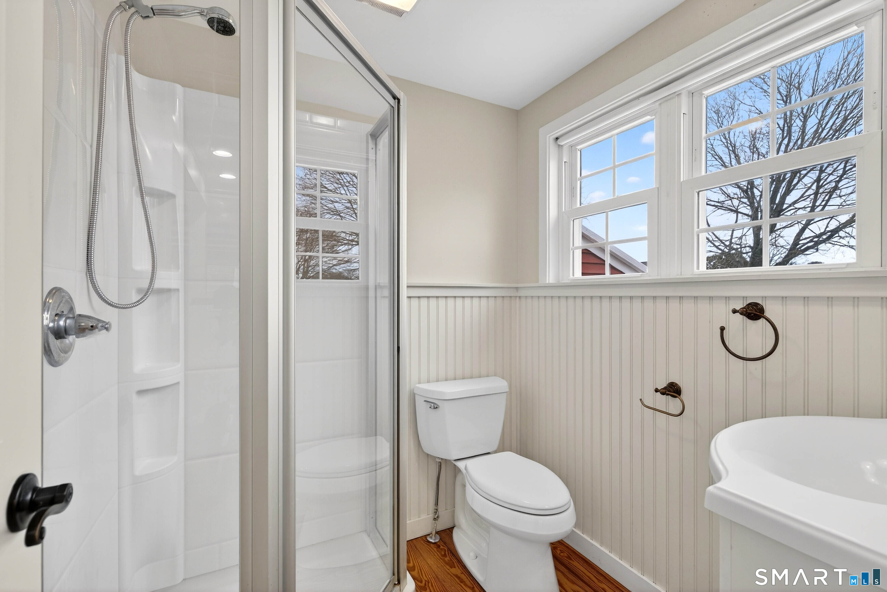 25 Pond Road Old Saybrook, CT 06475 - Photo 17 of 40 a bathroom with a toilet sink and shower